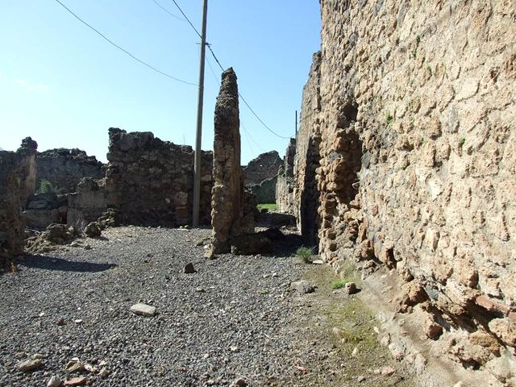 VII.6.19 Pompeii. March 2009. Workshop, rear room, site of steps to upper floor and corridor leading to house at VII.6.28.
