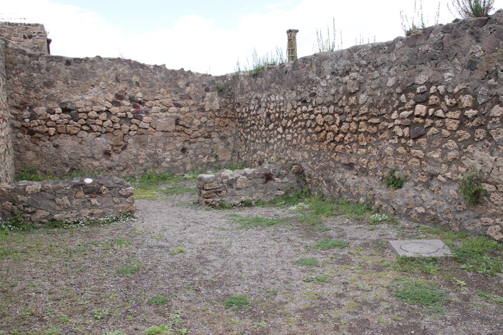 VII.7.1 Pompeii. May 2024. 
Looking towards north-east corner of shop-room, with doorway in north wall to rear room. Photo courtesy of Klaus Heese.
