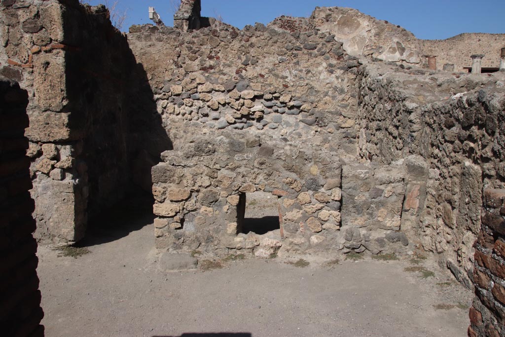 VII.7.9 Pompeii. October 2023. 
Looking through doorway of stairs at VII.7.8, into south-east room and rear room of VII.7.9. Photo courtesy of Klaus Heese.
