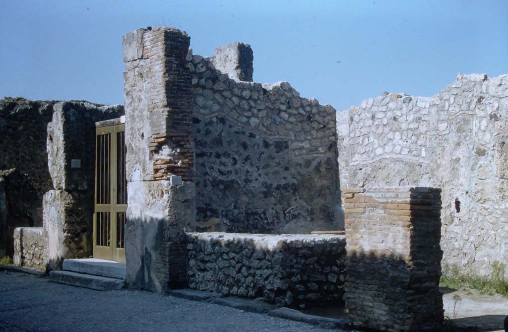 VII.7.11, VII.7.10 and VII.7.9, Pompeii. November 1961. 
Entrance doorways on north side of Via Marina. Photo courtesy of Rick Bauer. 

