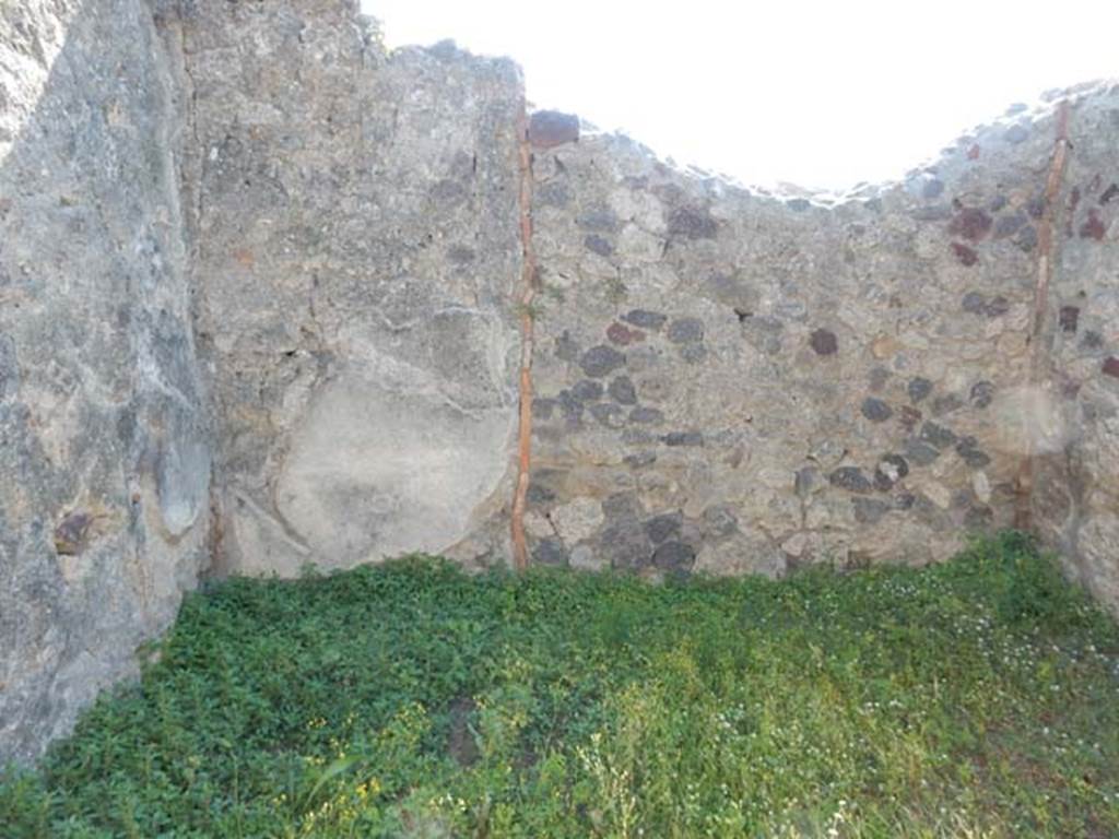 VII.7.10 Pompeii. May 2018. Room (c) on west side of atrium, looking west. Photo courtesy of Buzz Ferebee. 
According to Sogliano, fragments of a painting were found in this cubiculum. He described –
“Here you can see the remains of a figure, as it seems, manly, sitting and facing left. The upper part of the body was naked, the lower part covered with a dark-red cloak, which descending along his back rests with a sleeve on the left arm, and in whose hand he held an upside-down thyrsus. The head was missing as well as all of the right side of the figure with his legs; judging from its great abandonment one would think of Dionysus."
(“Vi si vede l’avanzo di una figura, come pare, virile, seduta e rivolta a sinistra. Nuda la parte superiore del corpo ha la inferiore coverta di clamide rosso-scura, la quale scendendole lungo il dorso riposa con un lembo sul braccio sinistro, che era poggiato, e nella cui mano essa regge un tirso capovolto. Manca la testa e tutto il lato destra della figura con le gambe; a guidicare dal suo mole abbandono si penserebbe a Dioniso.”)
Sogliano, A. (1879): Le pitture murali Campane scoverte negli anni 1867-79. (p.39, no.162).
Kuivalainen comments –
“Another variation of a common theme, in which the figure is identified by the thyrsus and the pose”.
See Kuivalainen, I., 2021. The Portrayal of Pompeian Bacchus. Commentationes Humanarum Litterarum 140. Helsinki: Finnish Society of Sciences and Letters, (p.101, B12).



