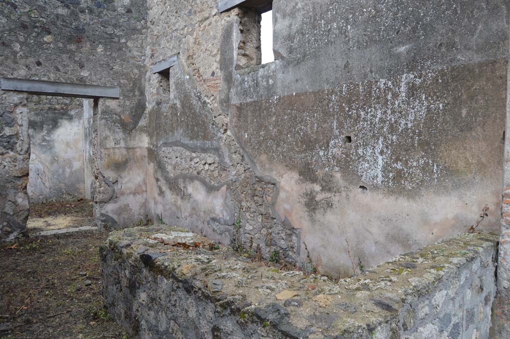 VII.7.18 Pompeii. March 2018. Looking south-west across counter in bar-room, towards west wall with outline of wooden stairs.  
Foto Taylor Lauritsen, ERC Grant 681269 DÉCOR.
