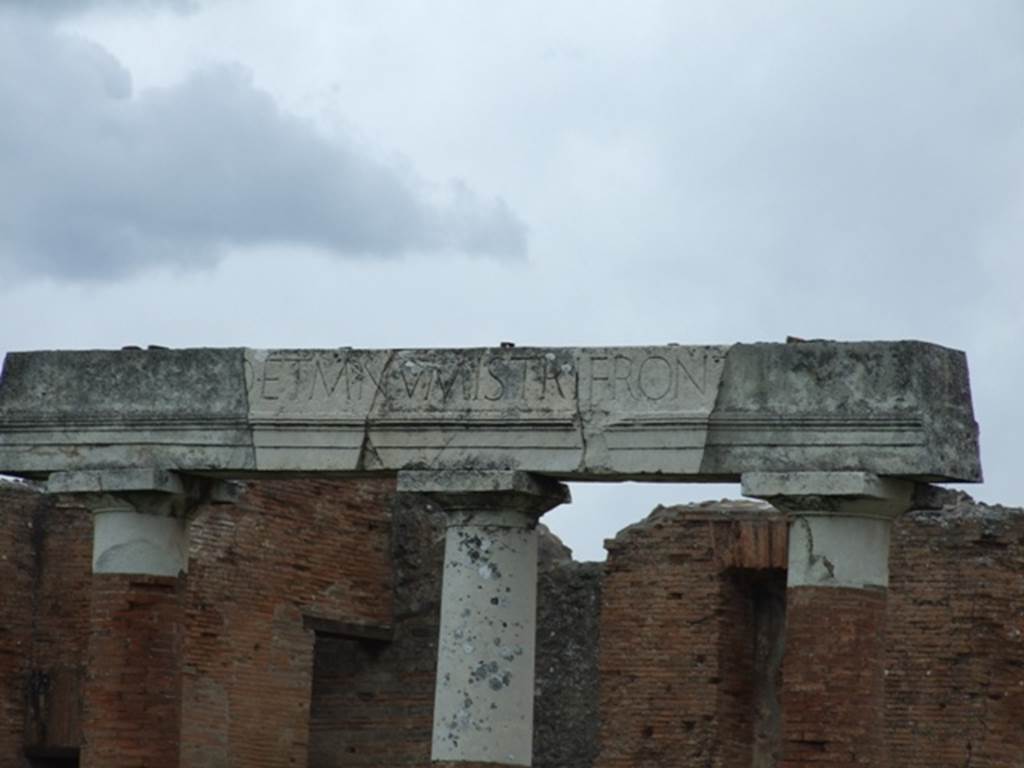 VII.8 Pompeii Forum.  March 2009. Latin inscription above columns in portico on east side. 