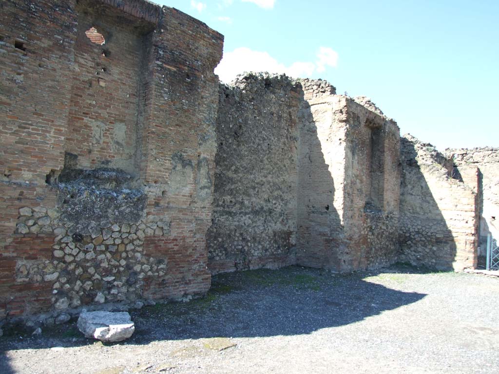 VII.9.1 Pompeii. March 2009.  West wall, north of entrance 6. Looking towards small niche 3 in north-west corner of courtyard.