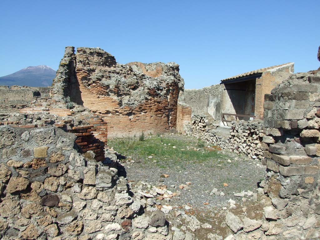 VII.9.1 Pompeii. March 2009. Looking north from south corridor 12 into light court 11.