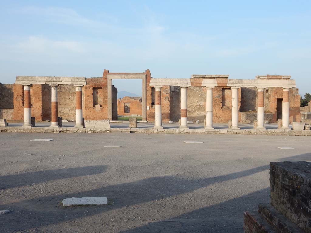 VII.9.1 Pompeii. June 2019. Looking east across Forum towards Eumachia’s Building portico, forming part of the colonnade of the Forum.
Photo courtesy of Buzz Ferebee.
