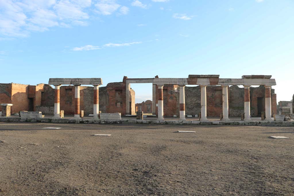 VII.9.1 Pompeii. December 2018. 
Looking east across Forum towards portico, and entrance doorway to Eumachia’s Building. Photo courtesy of Aude Durand. 

