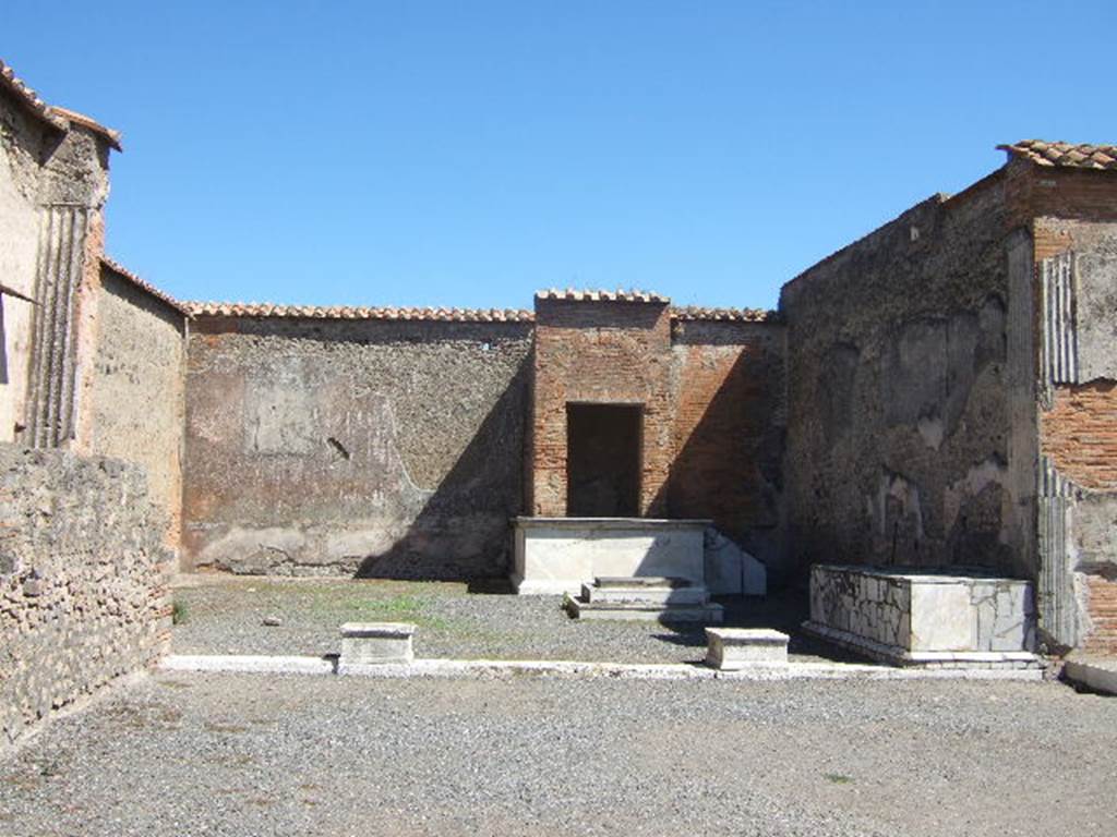 VII.9.7 and VII.9.8 Pompeii. Macellum. September 2005. North east corner. Large room of unknown function.  Looking east. This was perhaps used for religious purposes and banquets by those involved with administration of the Macellum.