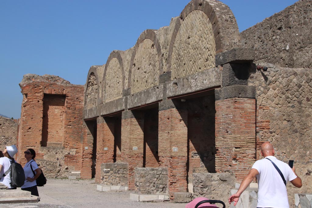 VII.9.9 Pompeii. October 2023. 
Looking towards entrances VII.9.12, 11, 10 and 9 in north-east corner of Forum. Photo courtesy of Klaus Heese.
