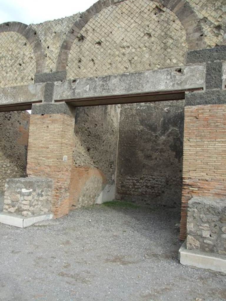 VII.9.10 Pompeii. December 2007. Entrance doorway with statue base on either side.