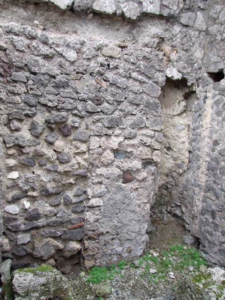 VII.9.21 Pompeii.  Shop.  December 2007.  East wall of rear room.