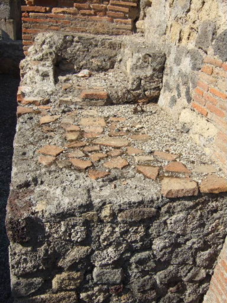 VII.9.31 Pompeii. September 2005. Oven or hearth in kitchen, looking west.