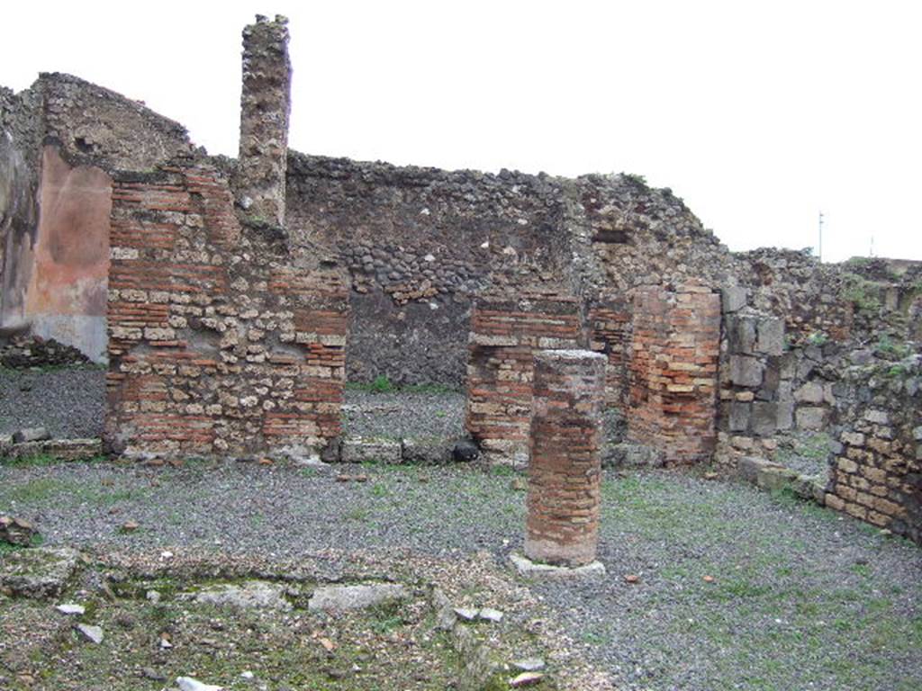 VII.9.38 Pompeii. December 2005. North-east corner of atrium, with doorways to cubiculum and area of light-yard and kitchen. 