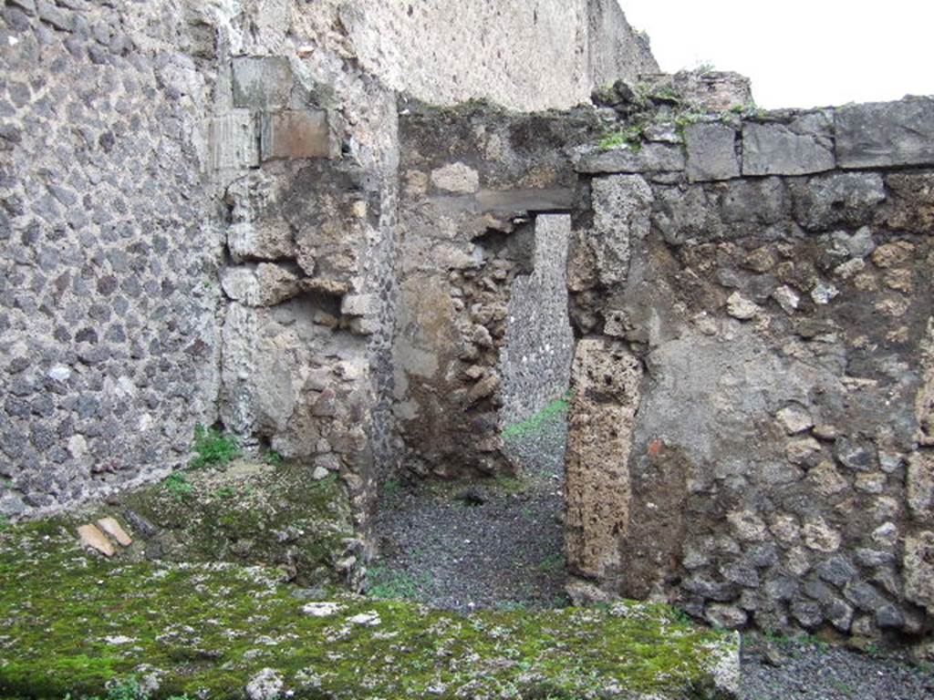 VII.9.41 Pompeii. December 2005. Looking north to doorway in north-west corner of workshop, leading to rear room  and entrance doorway to atrium of VII.9.40.