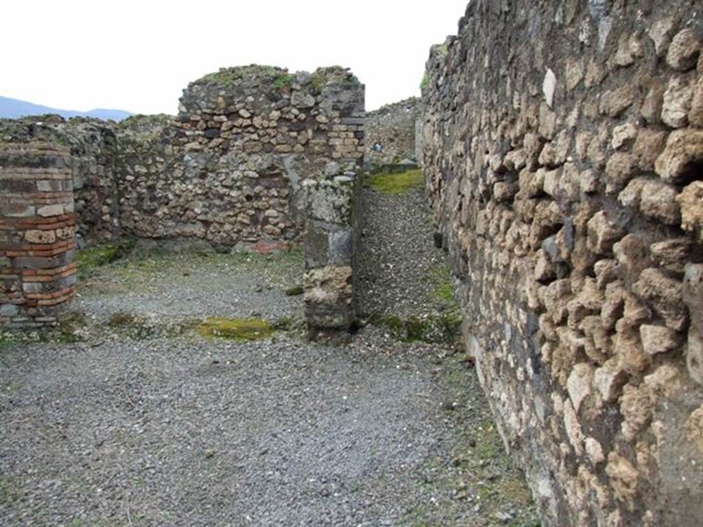 VII.9.51  Pompeii.  March 2009.   The slope of the ramp was for the animals to come from the stable of the house at VII.9.47. Looking south.