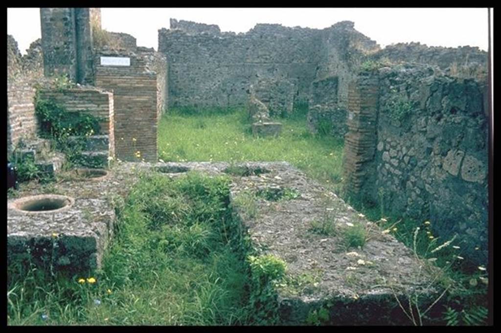 VII.9.54 Pompeii. Looking east across counter towards doorway VII.9.55 on Vicolo di Eumachia and VII.10.7, on the other side. Photographed 1970-79 by Gnther Einhorn, picture courtesy of his son Ralf Einhorn.

