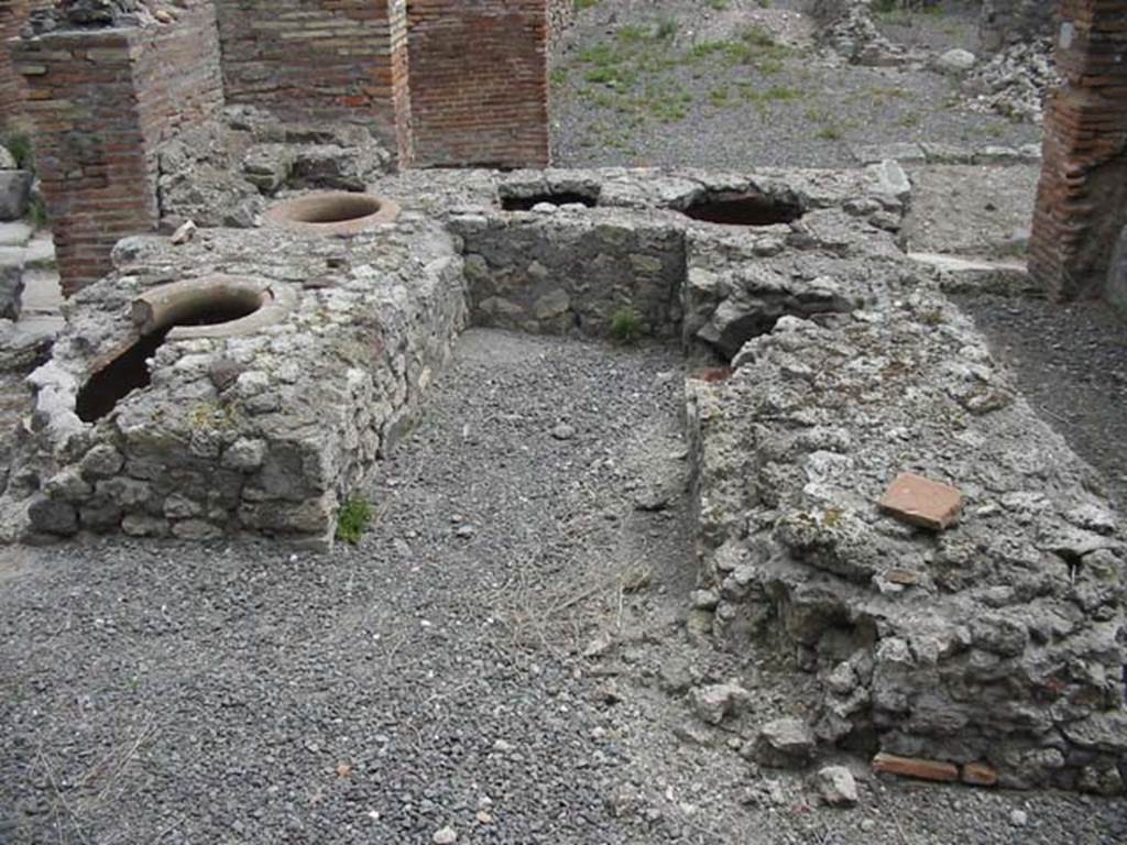 VII.9.54/5 Pompeii. May 2003. Looking east across counter from rear, the entrance at VII.9.54 is on the left. Photo courtesy of Nicolas Monteix.