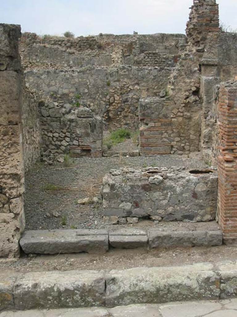 VII.9.56 Pompeii. May 2003. Looking west from entrance across counter to doorway to rear room. Photo courtesy of Nicolas Monteix.