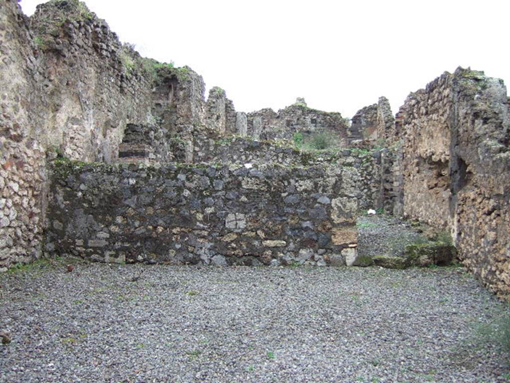 VII.9.58 Pompeii. December 2005. Looking west across shop towards doorway to rear room. 