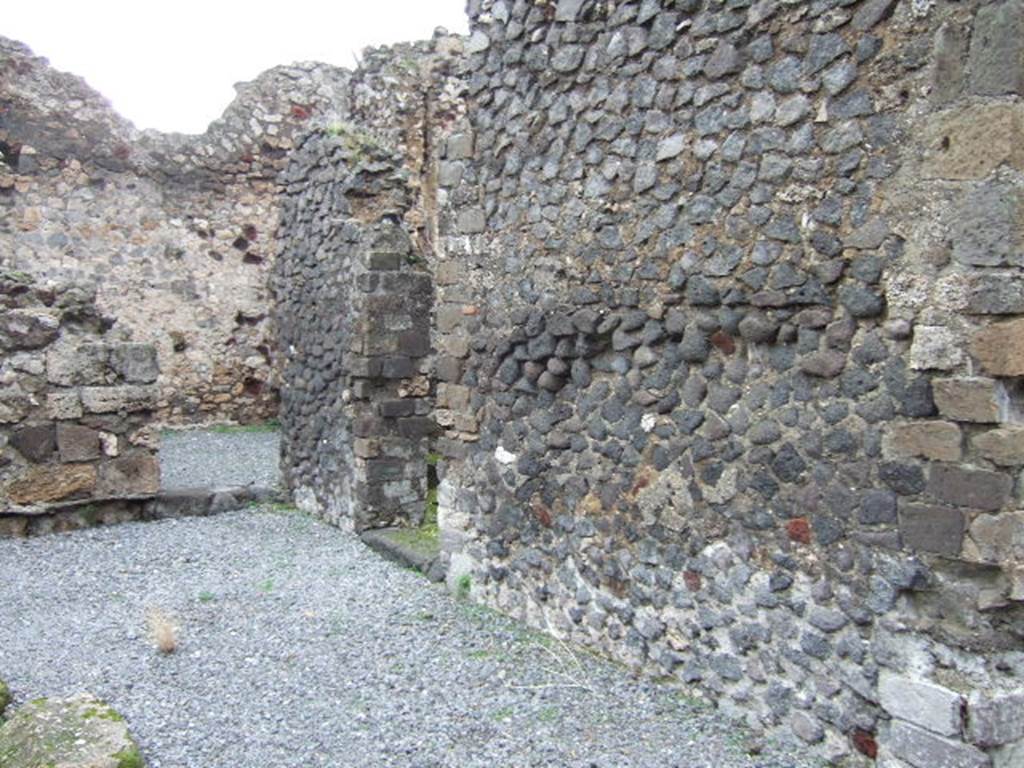 VII.9.63 Pompeii. December 2005. East side of atrium, one of these doorways on the east would have led through to peristyle area , see VII.9.60.