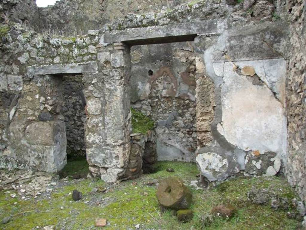 VII.10.12 Pompeii.  March 2009. West side of atrium, with doorways to Latrine and Kitchen (VII.10.9)