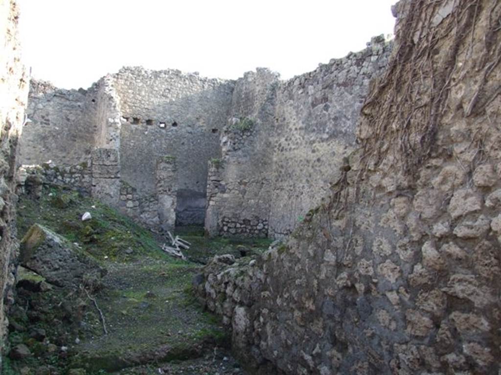 VII.11.2 Pompeii. December 2007. South wall of fauces and looking east to rear of dwelling.  