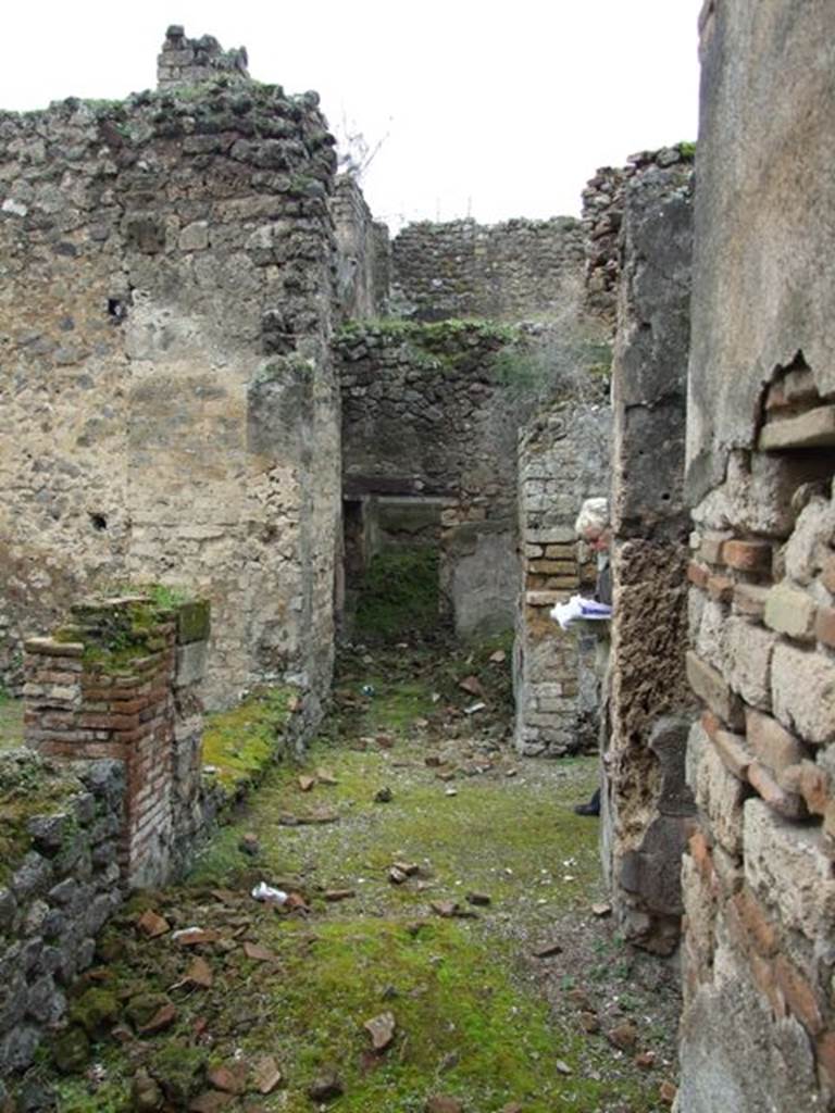 VII.11.14 Pompeii.  March 2009. Passageway.  Room 1.  Looking west towards Rooms 5 and 6.