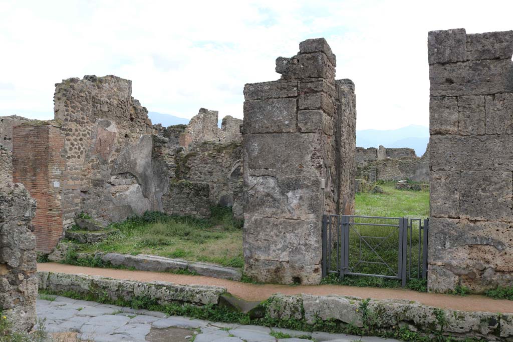 VII.12.3 Pompeii on right, and VII.12.4 on left. December 2018. 
Looking south on Via degli Augustali towards doorways. Photo courtesy of Aude Durand.

