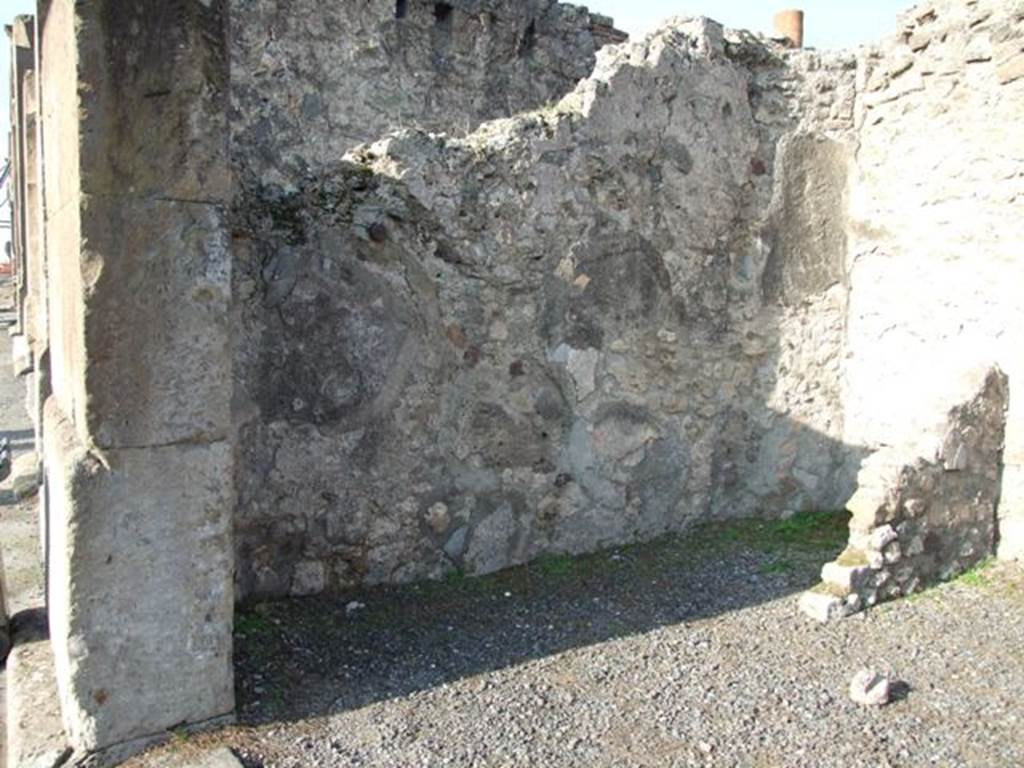 VII.13.5 Pompeii. December 2007. West wall of shop.