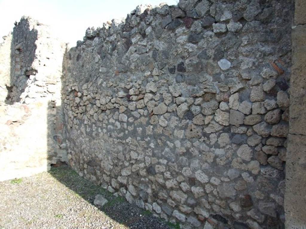 VII.13.6 Pompeii. December 2007.   East wall, with remains of clay pipe in north-east corner from latrine on upper floor.
