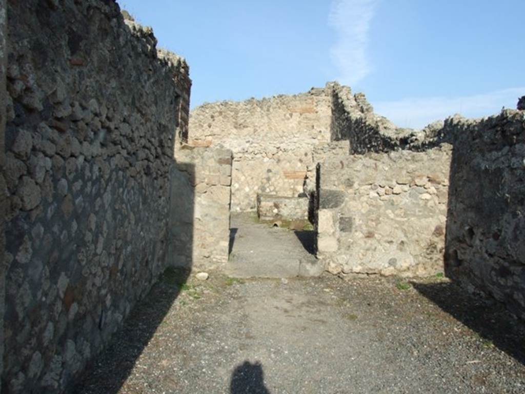 VII.13.7 Pompeii. December 2007. Looking north across shop to doorway to yard? of dwelling.