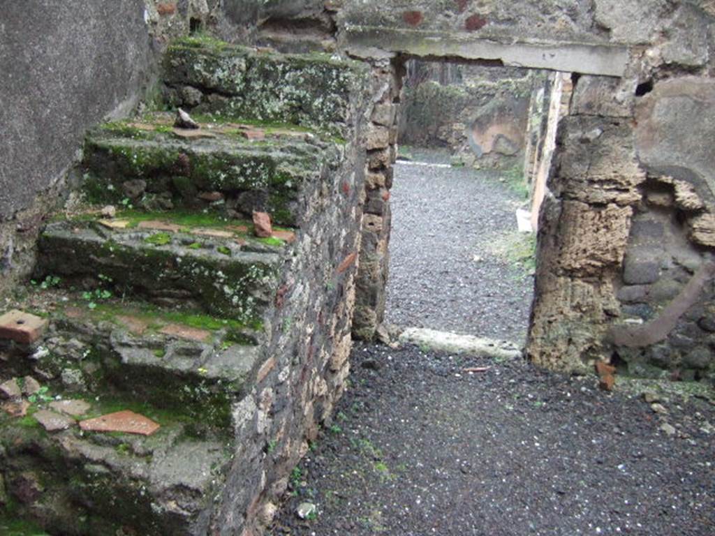 VII.13.8 Pompeii. December 2005. Room in north west corner of atrium. Stairs to upper floor, looking south.