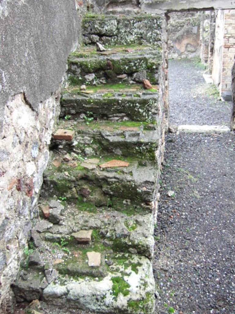 VII.13.8 Pompeii. December 2005. Room in north west corner of atrium. Stairs to upper floor, looking south.