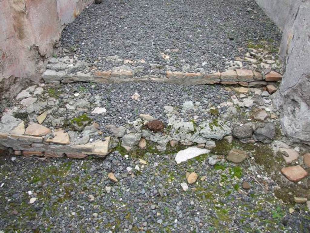 VII.14.5 Pompeii. March 2009. Remains of two steps from vestibule to fauces, or entrance corridor.