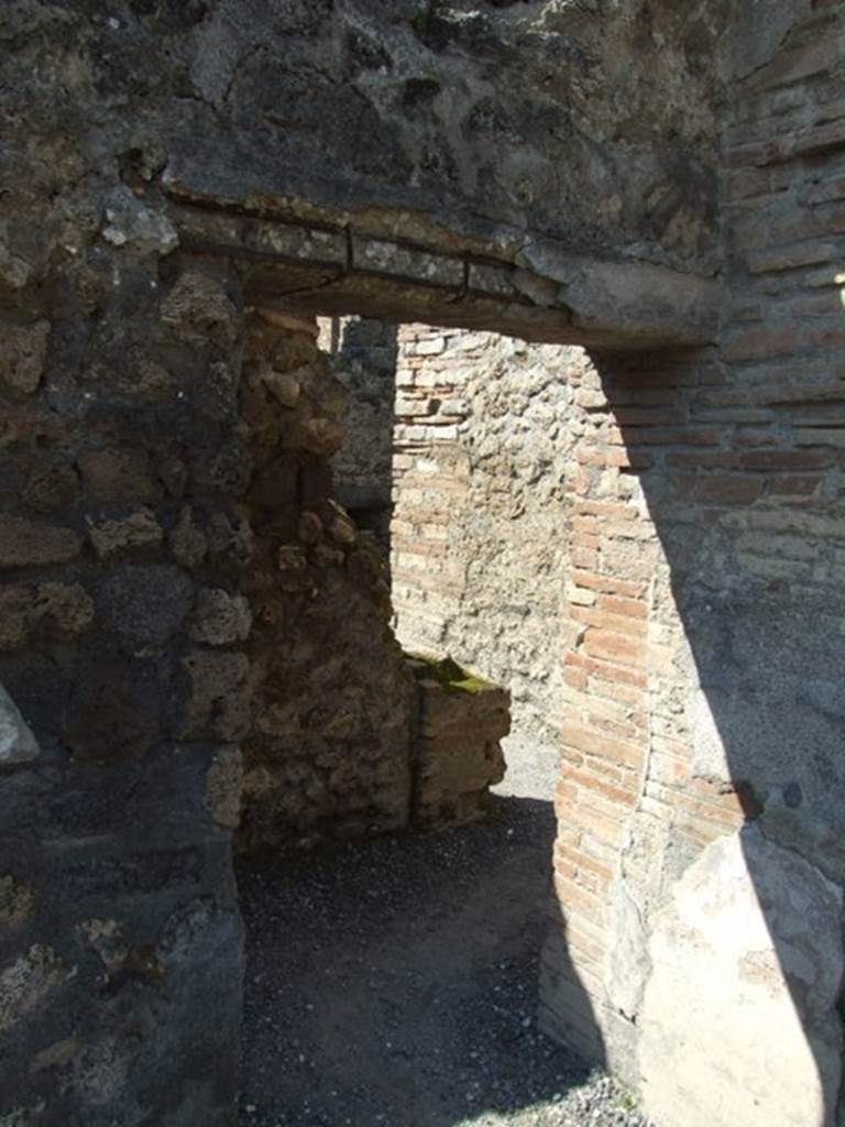 VII.14.9 Pompeii. March 2009. Doorway to room 6, corridor leading to services area.