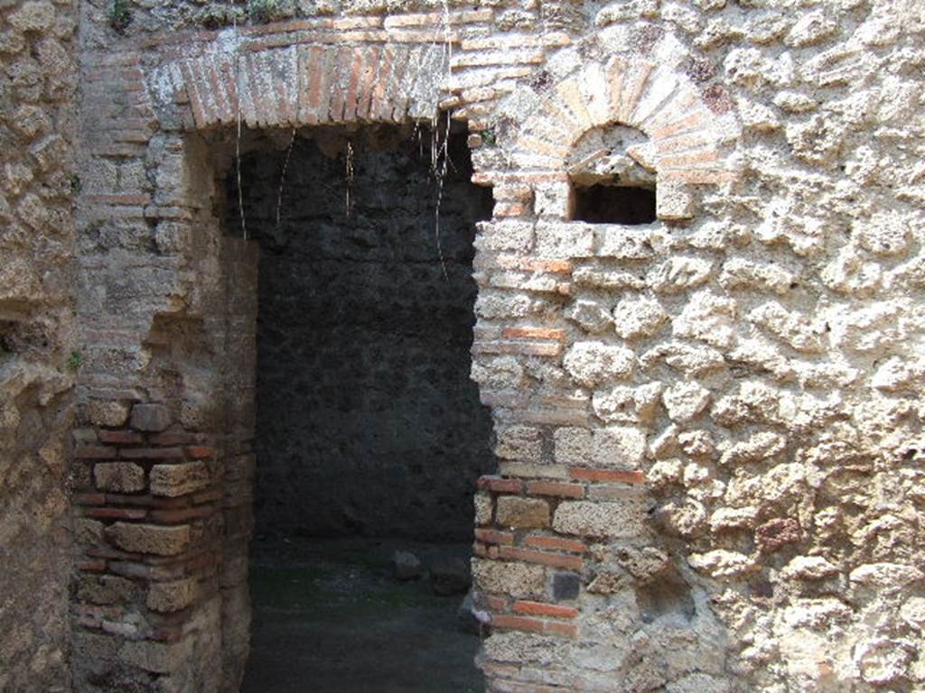 VII.14.9 Pompeii. May 2006. Room 9, north wall of bath suite, with doorway to room 10