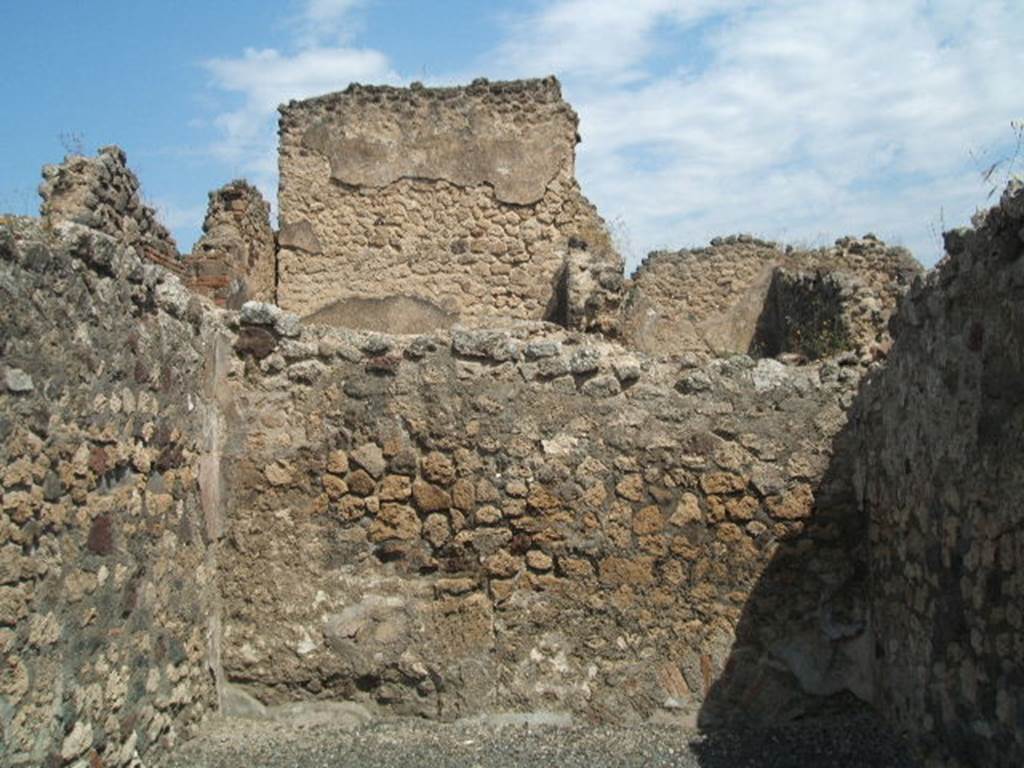 VII.14.11 Pompeii. May 2005. North wall of shop-room.