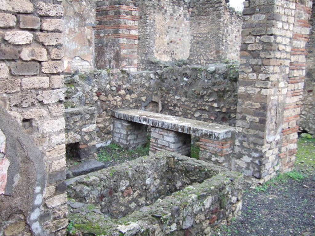 VII.14.18 Pompeii. December 2005. Looking east from entrance towards basin and marble bench on north side.