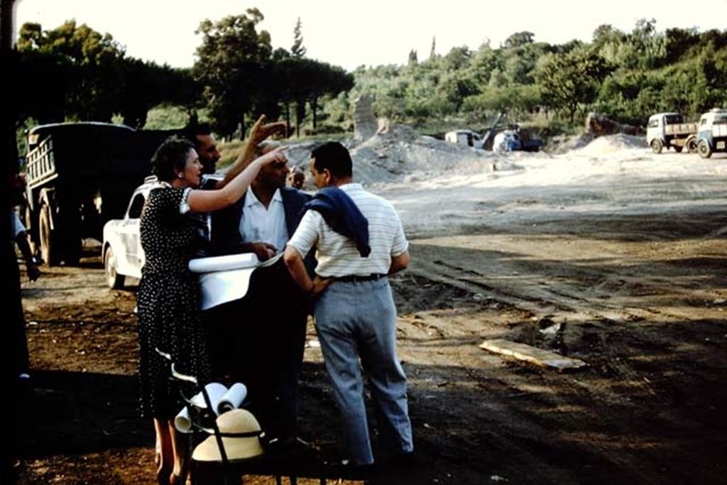 Wilhelmina Jashemski, Dr. Carlo Giordano and others discussing the new excavation. 1959.
Photo by Stanley A. Jashemski.
Source: The Wilhelmina and Stanley A. Jashemski archive in the University of Maryland Library, Special Collections (See collection page) and made available under the Creative Commons Attribution-Non Commercial License v.4. See Licence and use details.
J59f0120
