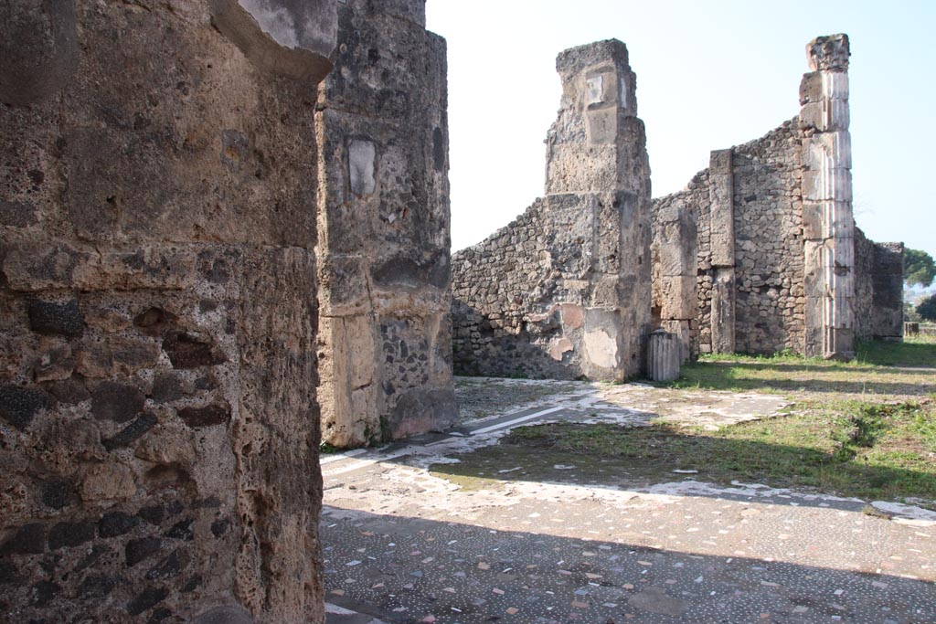 VII.16.13 Pompeii. October 2023. 
Looking west along south side of atrium 2, with ala 14, in centre, and tablinum 9, on right. Photo courtesy of Klaus Heese.
