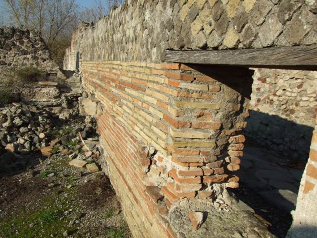 VII.16.16 Pompeii. December 2007. Looking north across remains of room 4, along inside of front wall on Vicolo del Gigante.