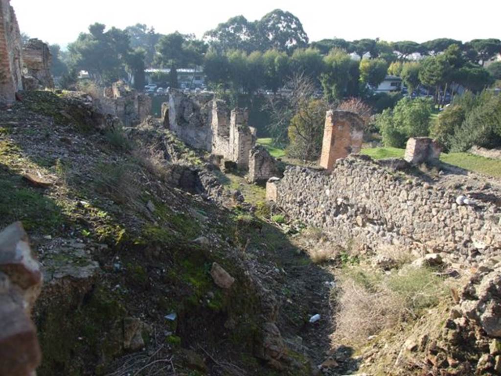 VII.16.16 Pompeii. September 2004. Looking west along site of rooms on the north side of room 2 atrium and rooms 15 and 16 towards room 17.