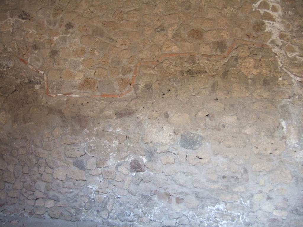 VII.16.19 Pompeii. September 2005.  Original wall (below the terracotta tiled line) and reconstructed wall (above the terracotta line).