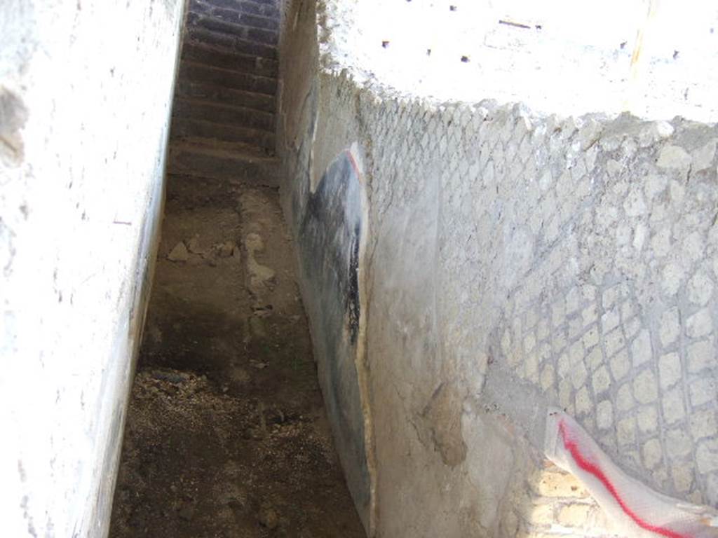 VII.16.17-22 Pompeii. May 2006. North end of rear garden area on lower ground level, looking east towards stairs from corridor alongside garden. 
