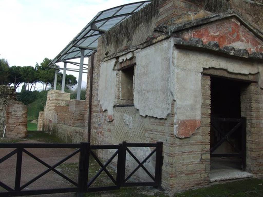 VII.16.a Pompeii. December 2006. Exterior of Room 1, looking north to pool at rear.