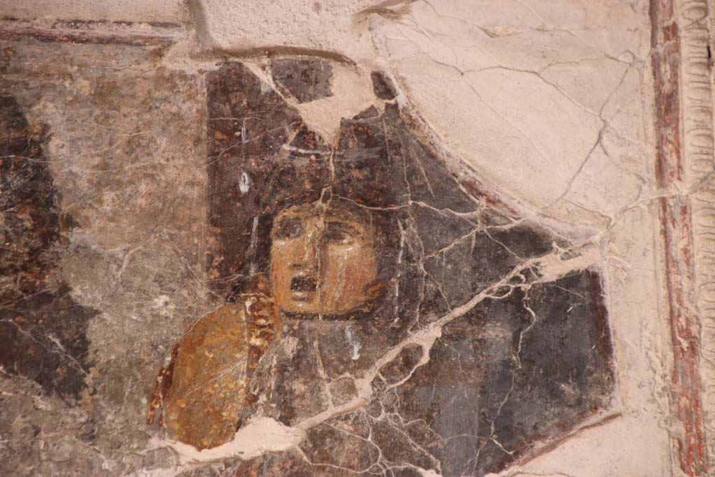 VII.16.a Pompeii. September 2021. Room 1, detail of mask on north wall.  Photo courtesy of Klaus Heese.