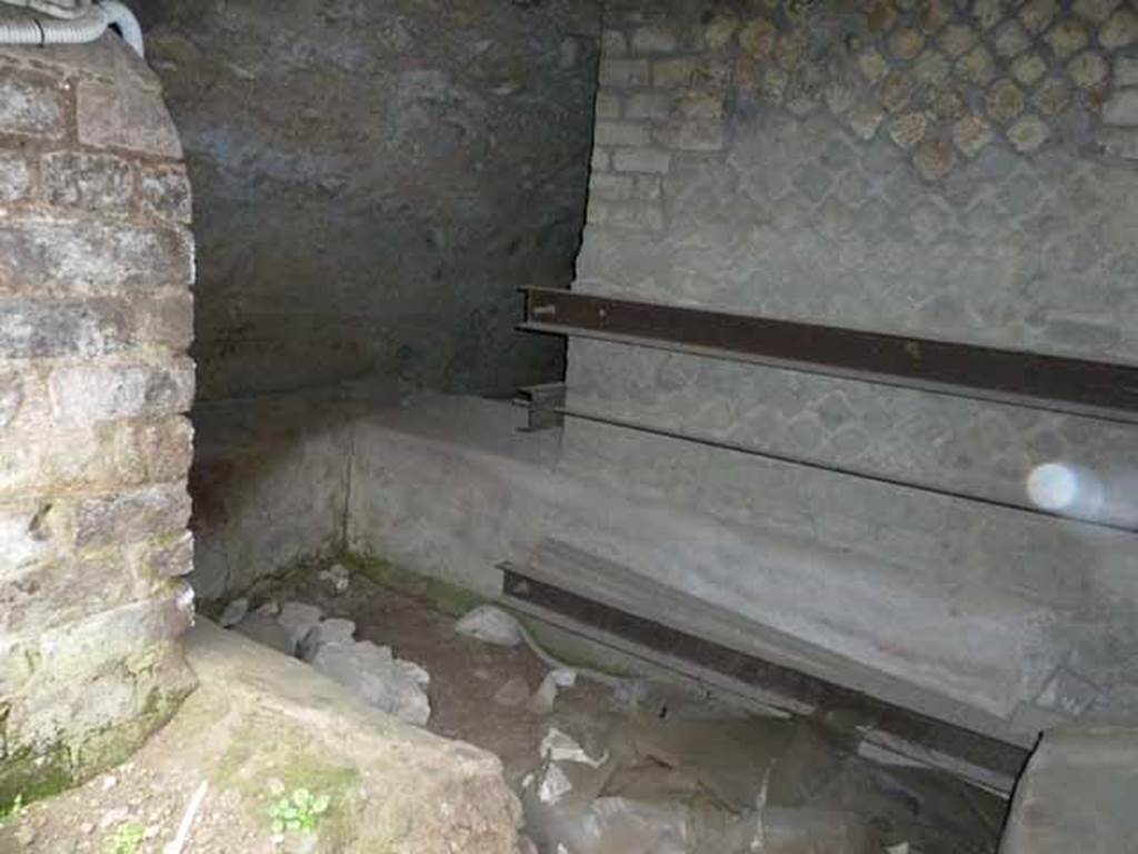 VII.16.a Pompeii. May 2010. Looking from square window in the rear wall, looking down into corridor.