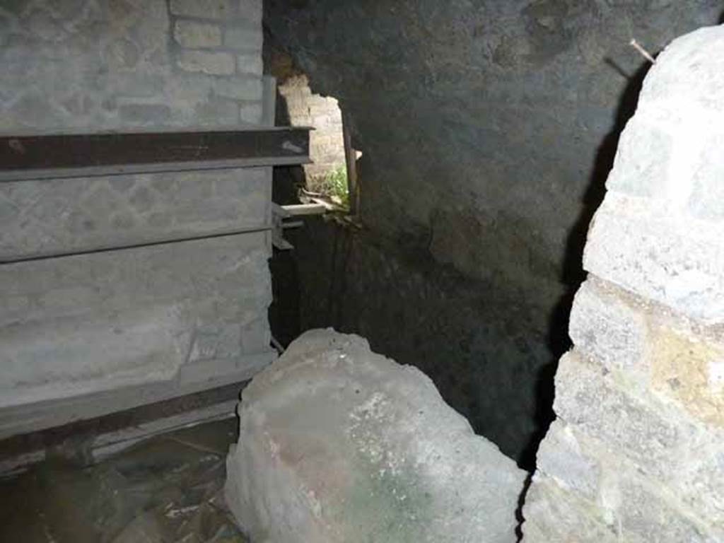 VII.16.a Pompeii. May 2010. Looking down from window in the rear wall, into corridor at rear.