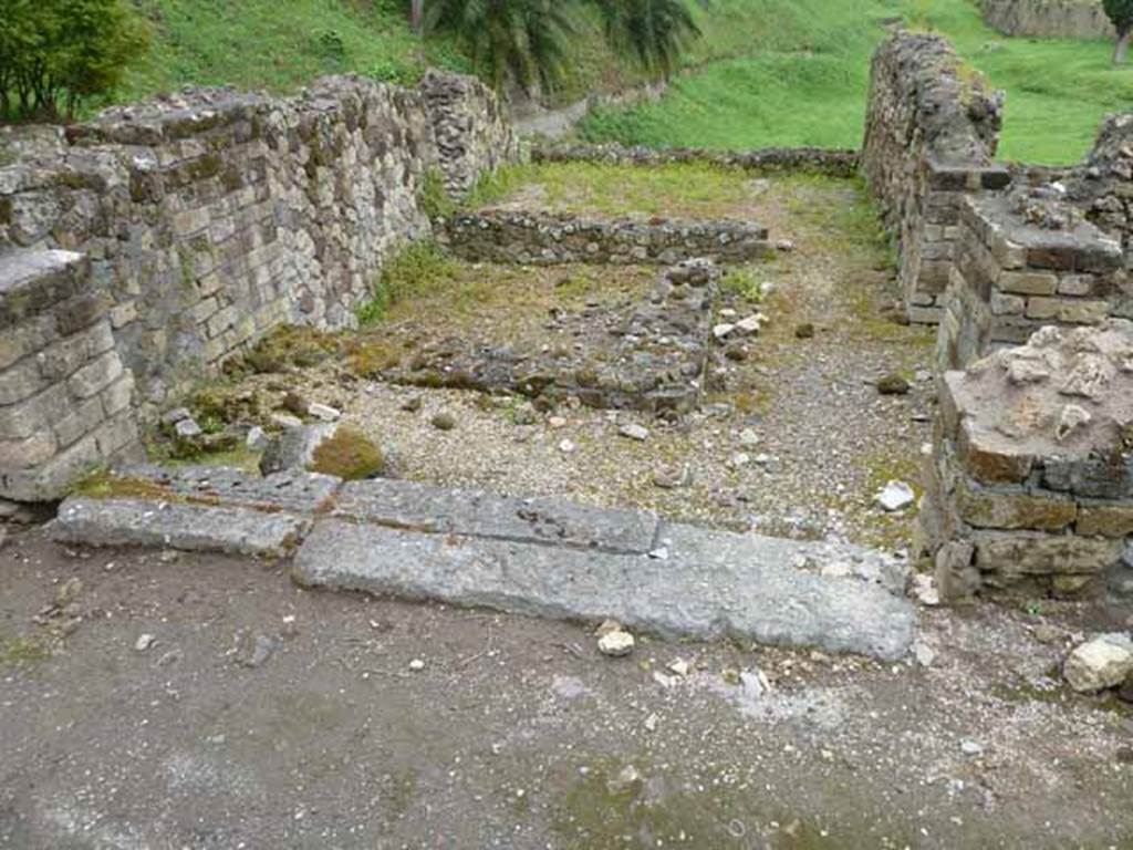 VII.16.a Pompeii. May 2010. Looking north across threshold, into lower area – shops, or rooms?