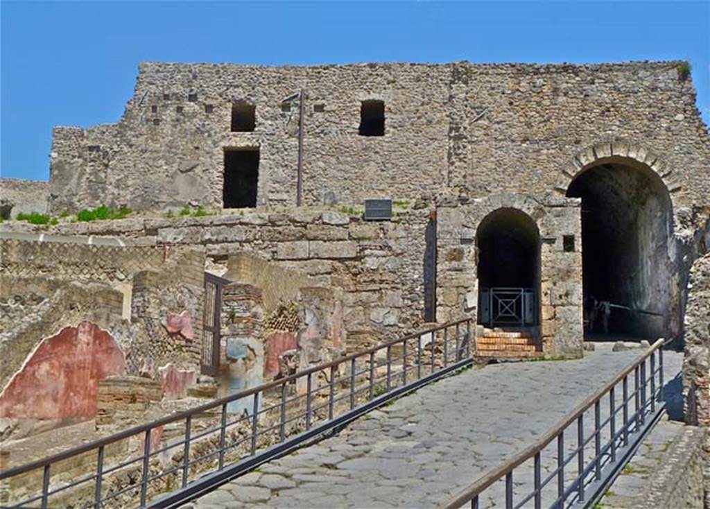 VII.16.a Pompeii. May 2011. Looking east towards doorway to rooms on upper level, and Porta Marina. Photo courtesy of Michael Binns.
